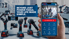 一部手机显示博世工具的应用程序，背景中有设备。